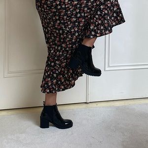 Shiny patent leather booties